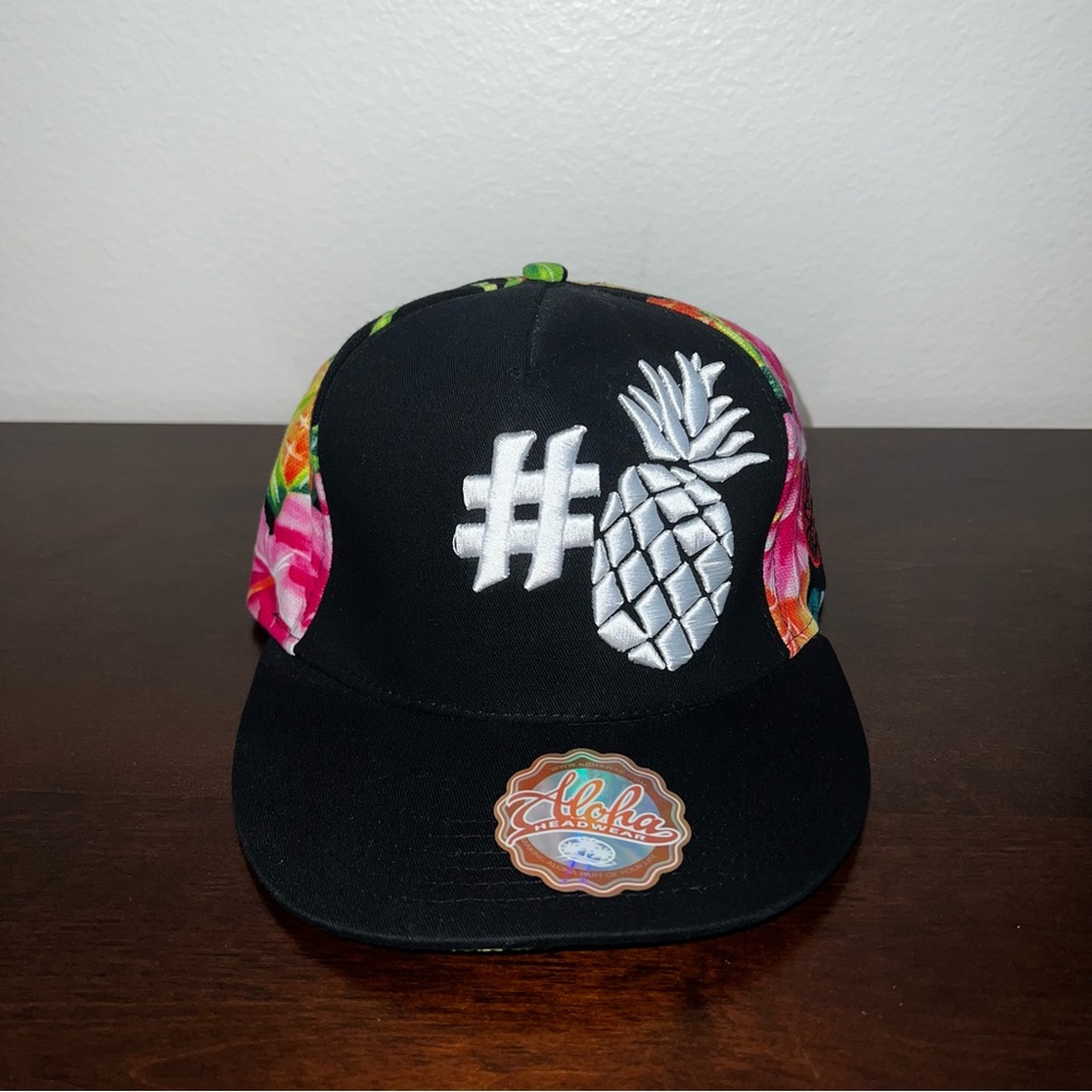 NWT Aloha Headwear strap back. Black with floral print.